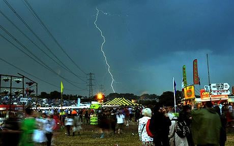 Lightning flashes at the 2009 Glastonbury Festival taking place at Worthy Farm in Somerset: Mudbath fears as storms hit Glastonbury 